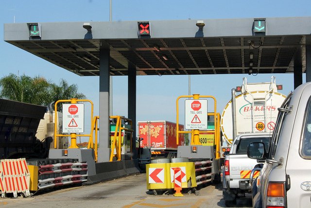 Vehicles passing through a Zimbabwe highway toll plaza
